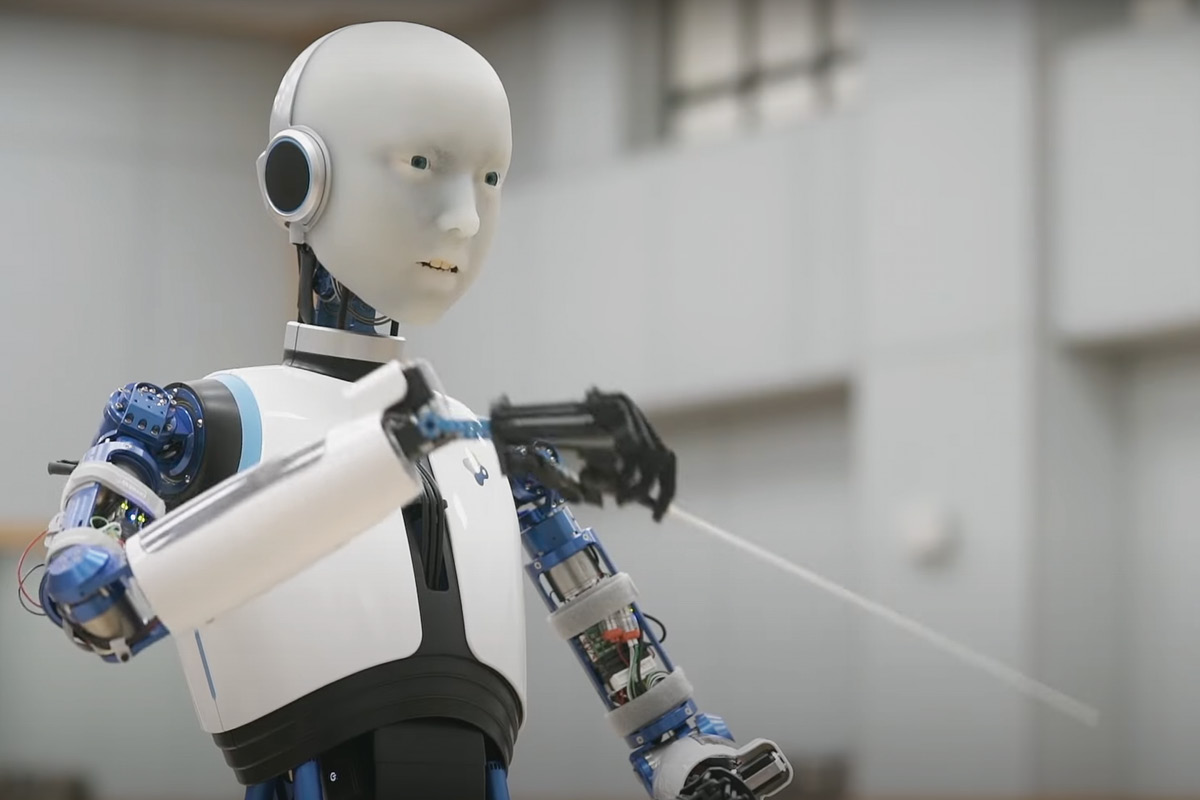A humanoid robot holding a baton, conducting.