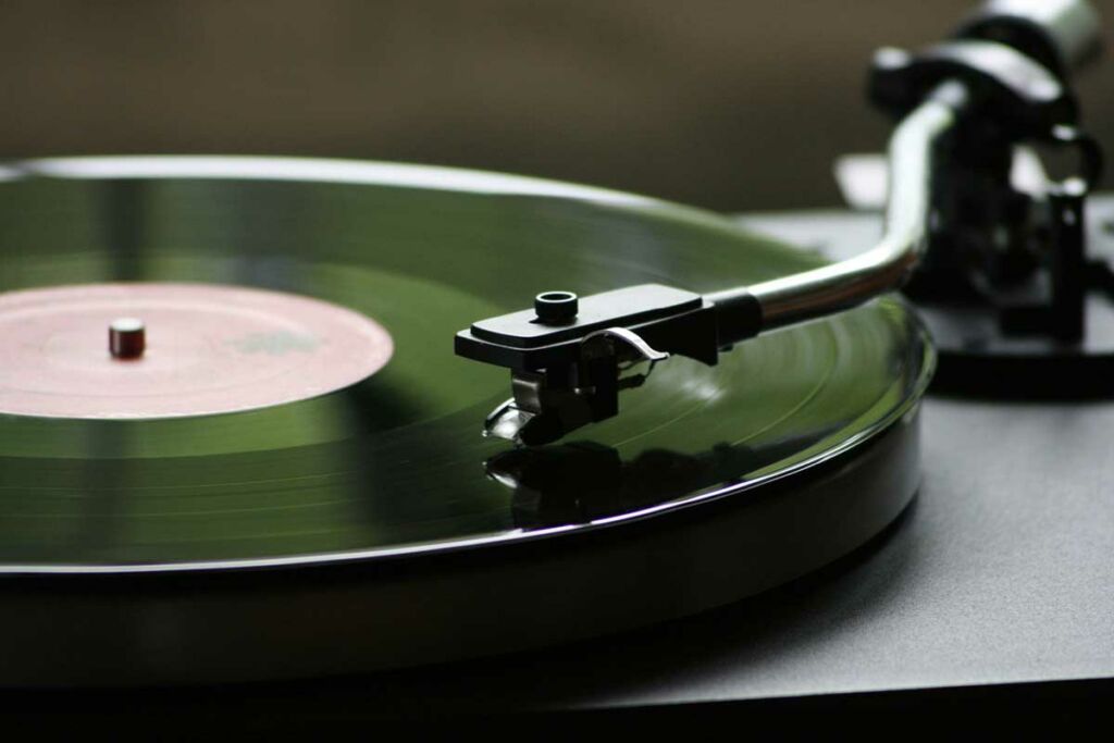 A vinyl record being played on a modern record player.