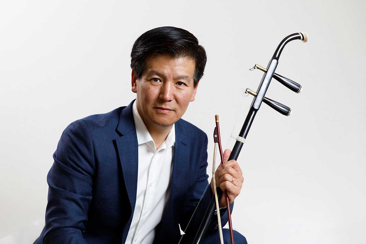 Dong Ma holding his erhu.