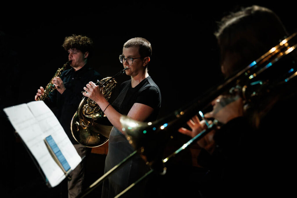 Forest Collective performing on stage.