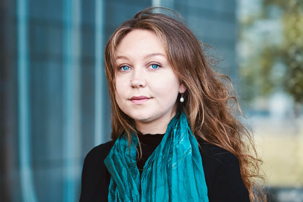 Kirsten Milenko in a blue scarf.