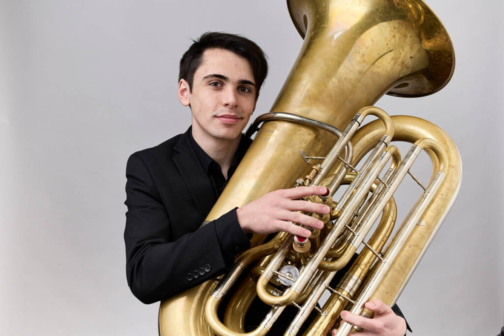 Stanley McDonald holds his tuba.