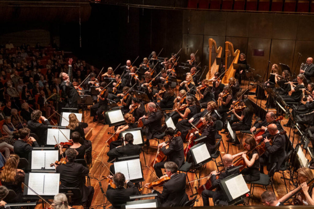 Alexander Briger conducting the Australian World Orchestra.